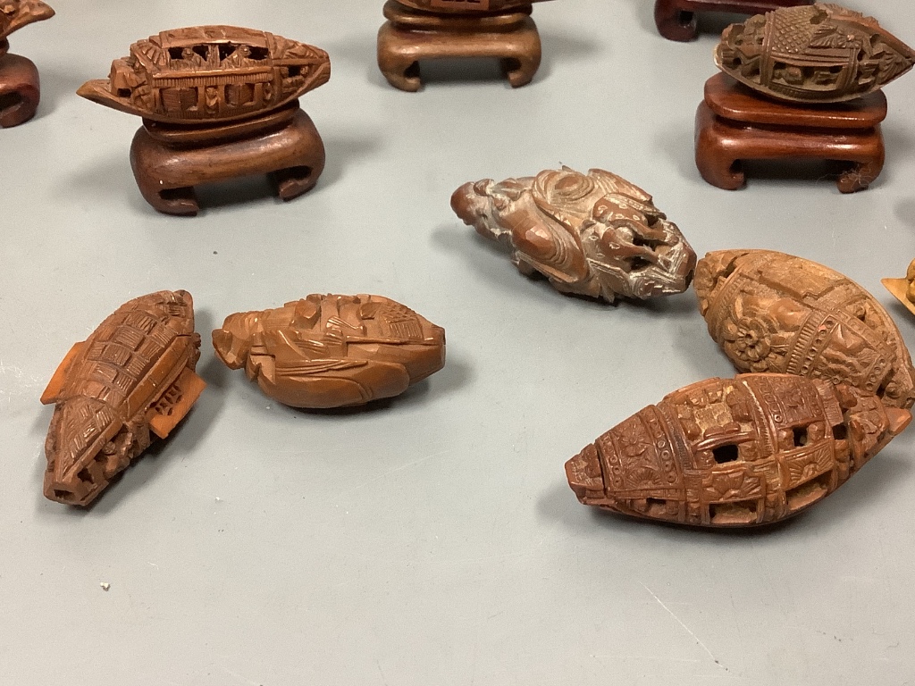 An assortment of Chinese peach stone and nut carvings